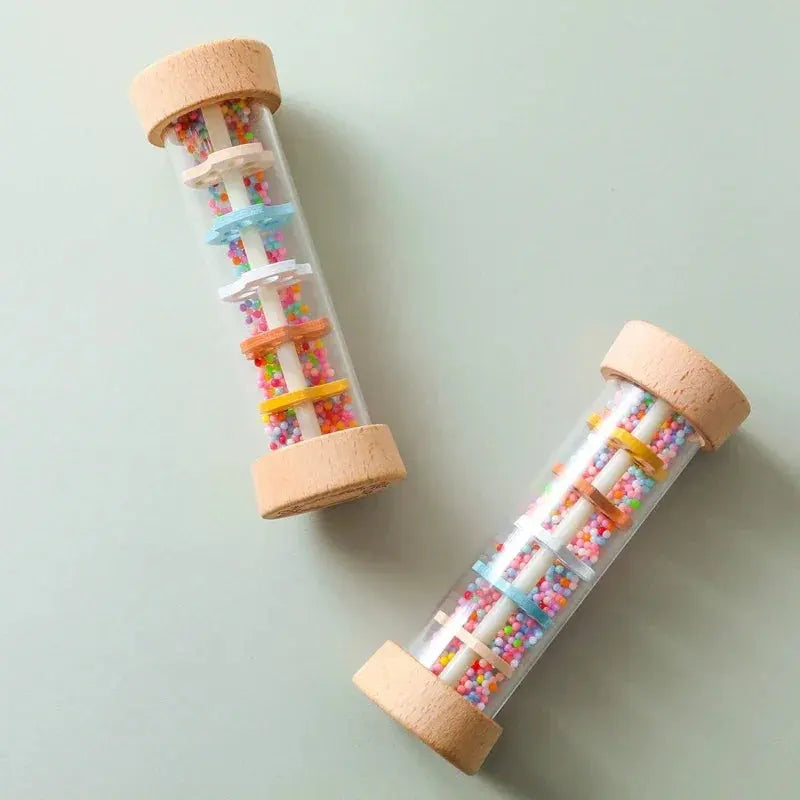 Two tubes filled with colorful beads on a light gray background
