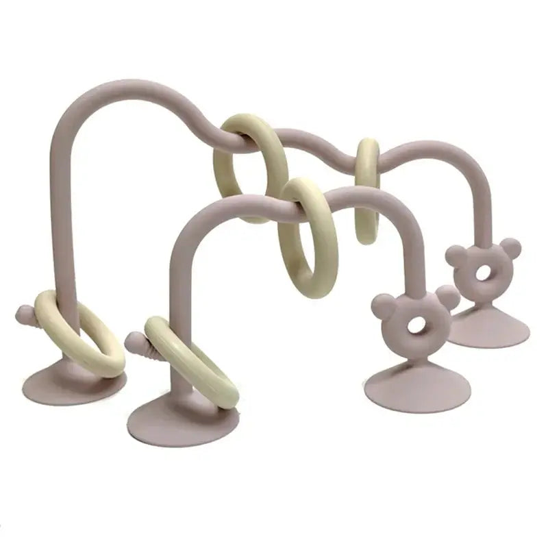 Baby teething ring with multiple rings and suction cups on a white background