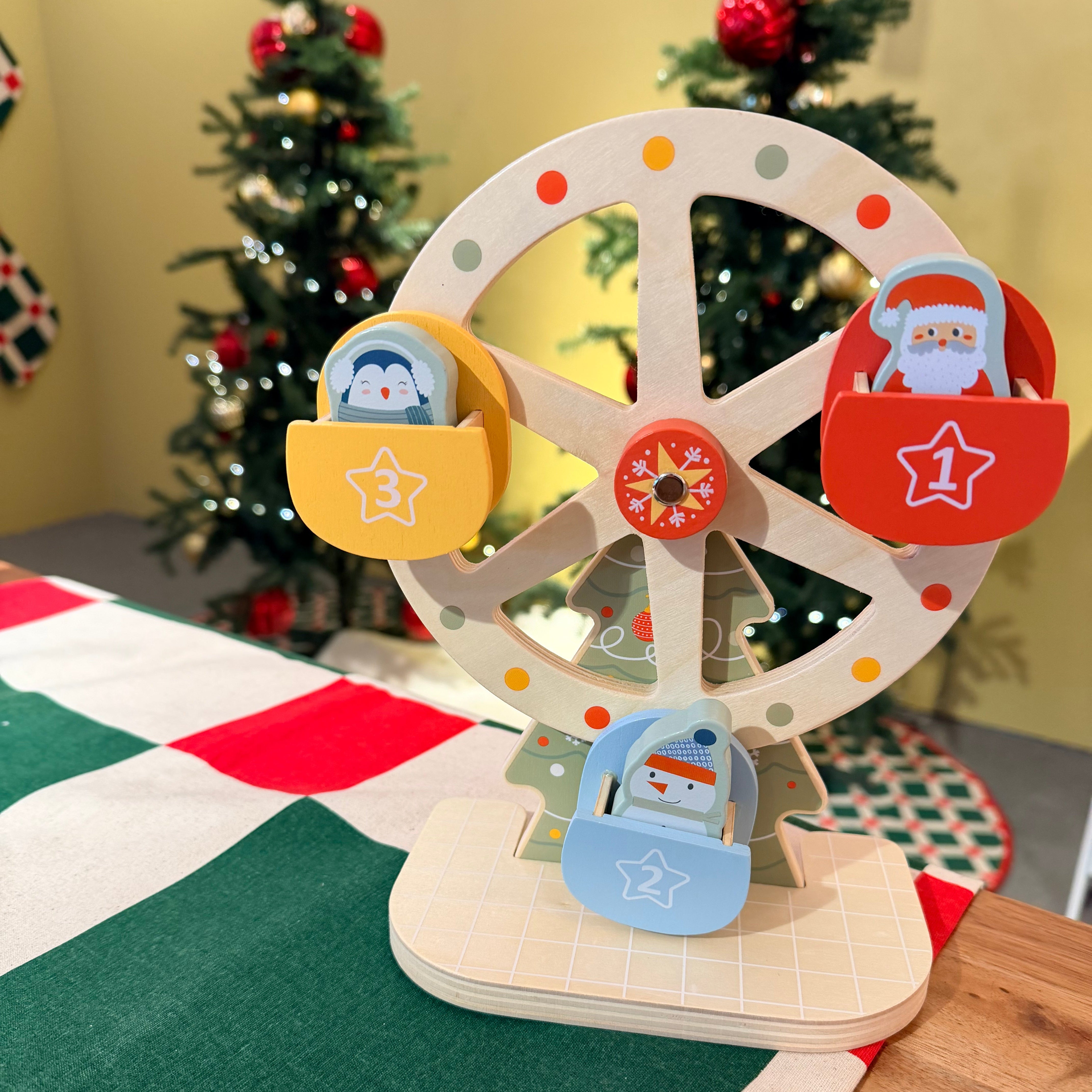 Colourful wooden toy with wheels and Christmas-themed decorations in the background